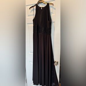 JS black gown, with black sequins at bodice. Split modestly in front of